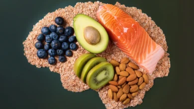 A colorful assortment of brain-boosting foods including salmon, berries, nuts, and avocado